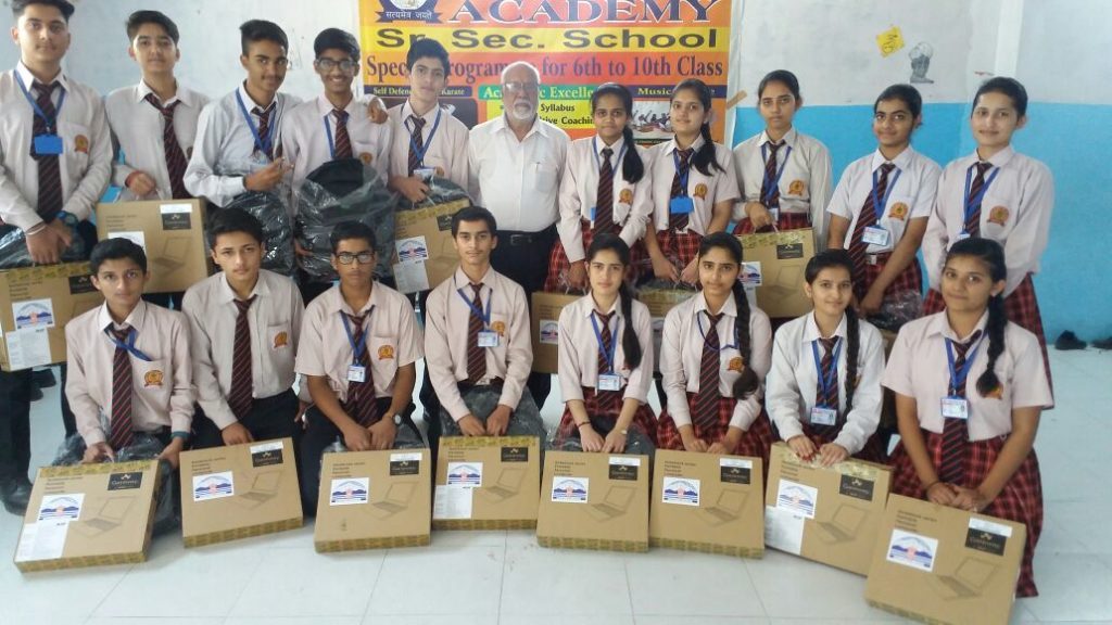 Students with their laptops Students with their laptops